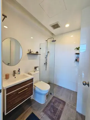 a bathroom with a toilet and a glass shower at The viva patong condo C602 in Patong Beach