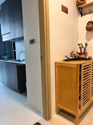 a kitchen with a wooden cabinet and a counter top at The viva patong condo C602 in Patong Beach