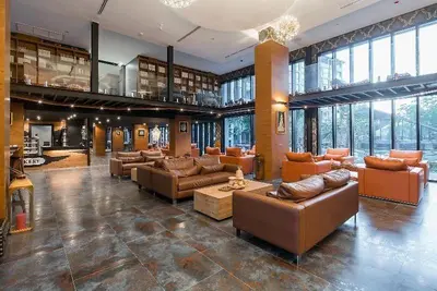 a large room with couches and tables in a building at Citygate serviced apartments Kamala beach, rooftop pool and gym P311 in Kamala Beach