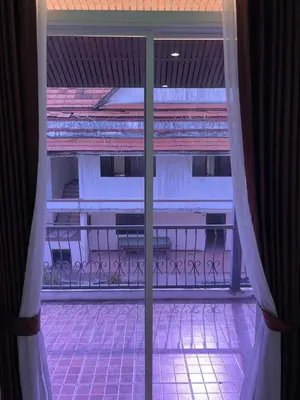 a view of a balcony from a window at Mipiace in Kamala Beach