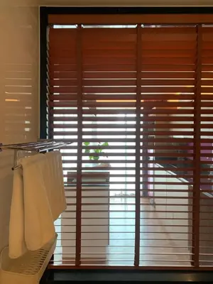 a window with blinds in a bathroom with towels at Luxury Suite Room by Atlas X in Kata Beach