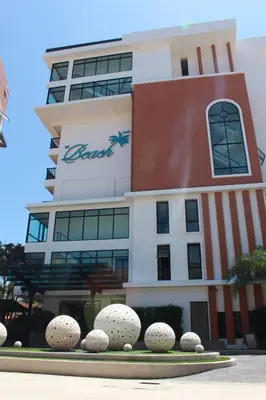 a building with a sign on the side of it at Luxury Suite Room by Atlas X in Kata Beach