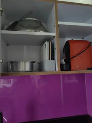 a shelf with some pots and pans on it at Luxury Suite Room by Atlas X in Kata Beach