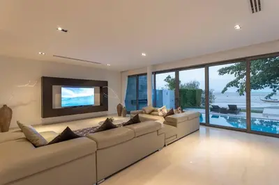 a large living room with a large couch and a tv at Do You Want Luxury Sea views With Beach Access V38 in Rawai Beach