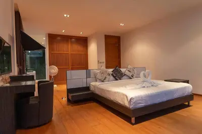 a bedroom with a large bed and a piano at Do You Want Luxury Sea views With Beach Access V38 in Rawai Beach