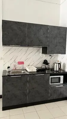 a kitchen with a sink and a counter top at Apartments Kata Beach in Kata Beach