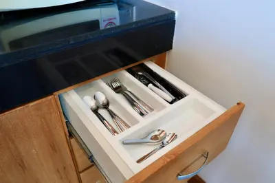 a drawer with silver utensils in a kitchen at 208 Ao Nang, Private Sea View Pool Villa in Krabi town