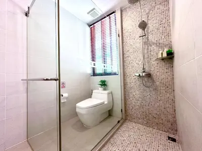 a bathroom with a toilet and a glass shower at 208 Ao Nang, Private Sea View Pool Villa in Krabi town