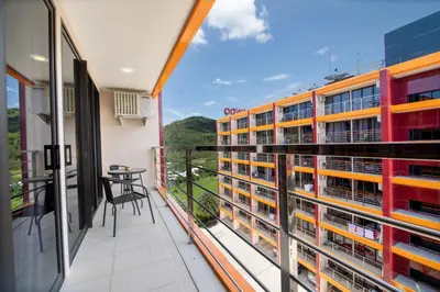 a balcony with a view of a building at Nai Harn Beach Condominimum in Phuket Town