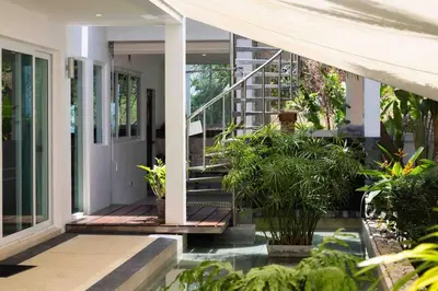 a front porch of a house with plants at Luxurious 5 bedroom 5 bathroom Gym Views v138 in Kamala Beach