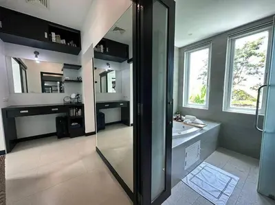a bathroom with a shower and a sink and a mirror at Luxurious 5 bedroom 5 bathroom Gym Views v138 in Kamala Beach