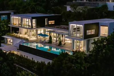 an aerial view of a house with a swimming pool at Phuket 4-6 Bedroom Seaview Villa Infinity 25mPool In-Villa Dining & Butler Gym in Thalang