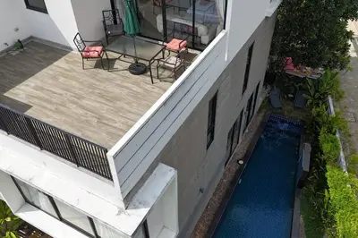 an aerial view of a house with a swimming pool at Happy House in Laguna Park in Laguna Phuket