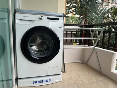 a washer and dryer sitting on a balcony at Phuket Villa Patong,Pool View in Patong Beach