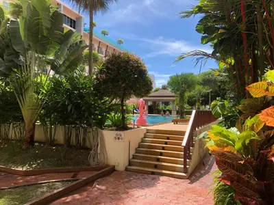 a resort with a swimming pool and a resort at Phuket Villa Patong,Pool View in Patong Beach