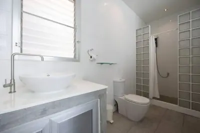 a white bathroom with a sink and a toilet at Secluded Paradise Your Exclusive Villa Retreat V82 in Rawai Beach