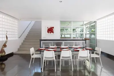 a dining room with a table and white chairs at Secluded Paradise Your Exclusive Villa Retreat V82 in Rawai Beach