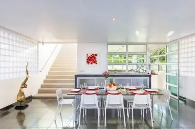 a dining room with a table and white chairs at Secluded Paradise Your Exclusive Villa Retreat V82 in Rawai Beach