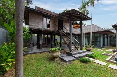a house with a staircase leading to the front of it at Villa Bulan with 3BR with Yoga house Nai Harn in Rawai Beach