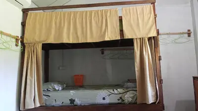 a bunk bed with a canopy in a room at Mukda in Ko Yao Noi