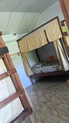 a bedroom with two bunk beds in a room at Mukda in Ko Yao Noi