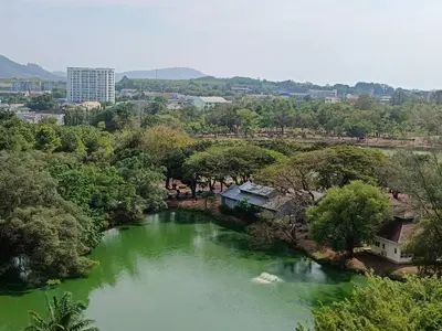 a river with green water in a city at Condo 1 bed in Phuket City Center 8th Floor in Ban Rangeng