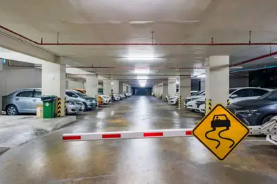 a parking garage with cars parked in it at Condo 1 bed in Phuket City Center 8th Floor in Ban Rangeng