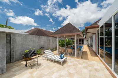 a patio of a house with a swimming pool at Bangtao villa 3 bedroom in Phuket Town