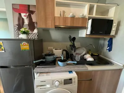 a kitchen with a sink and a washing machine at Zcape X2 boat avenue by sahana in Bang Tao Beach