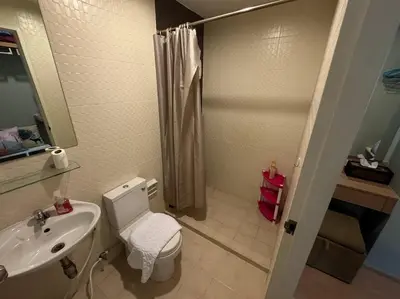 a bathroom with a toilet and a sink and a shower at Zcape X2 boat avenue by sahana in Bang Tao Beach