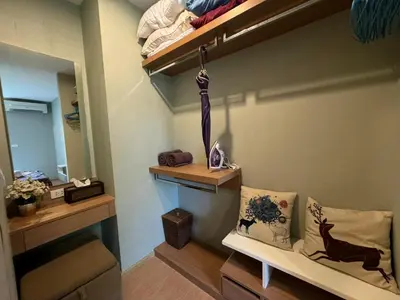 a room with an umbrella hanging on a wall at Zcape X2 boat avenue by sahana in Bang Tao Beach