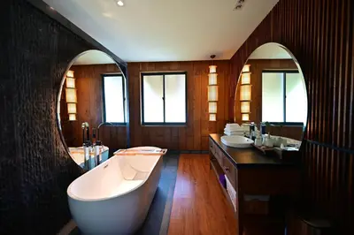 a large bathroom with a tub and a sink at Big Sun Residences By iRETREAT in Ko Yao Noi