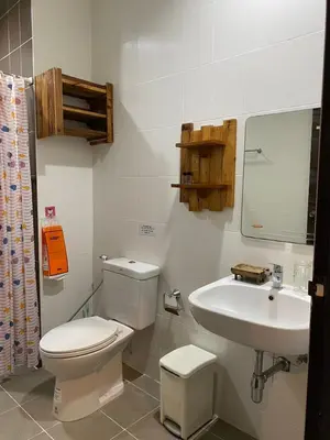 a bathroom with a toilet and a sink at Maria's Guest House, Rawai in Rawai Beach