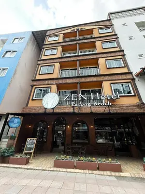 a building with a sign on the front of it at ZEN Hotel Patong Beach -ex- miami Production in Patong Beach