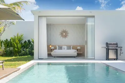a bedroom with a bed and a swimming pool at Luxury villa near Bangtao beach in Phuket Town
