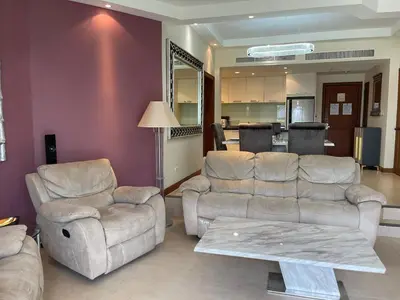 a living room with a couch and two chairs and a table at Allamanda Laguna 2 BR c выходом к бассейну in Phuket Town