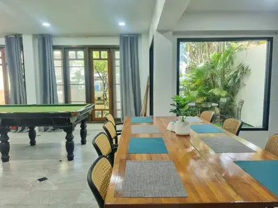 a dining room with a pool table and a pool table at Cozy Villa 4 Bedrooms Patong,7mins. walk beach/10mns.Bangla Rd in Patong Beach