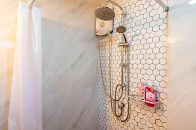 a shower curtain in a bathroom with a shower head at Cozy Villa 4 Bedrooms Patong,7mins. walk beach/10mns.Bangla Rd in Patong Beach