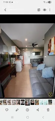 a living room with a couch and a table at Kamala Falls Seaview 2 bedroom in Kamala Beach