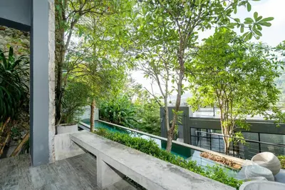 a view of the garden from the balcony of a house at 2BR Pavilion near Kamala Beach, Natural Park P10 in Kamala Beach