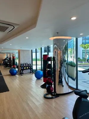 a gym with a room with a lot of exercise equipment at Duplex in a 5 star hotel La Vita in Phuket Town