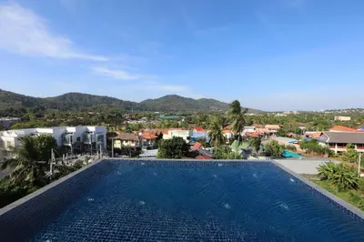 a view of a swimming pool at a resort at 1bdr Apartment near NaiHarn beach by Capital Pro in Phuket Town