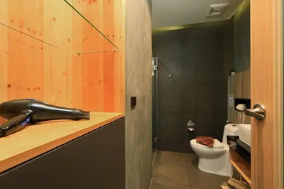 a bathroom with a sink and a toilet at 1bdr Apartment near NaiHarn beach by Capital Pro in Phuket Town