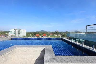 a swimming pool on the roof of a building at 1bdr Apartment near NaiHarn beach by Capital Pro in Phuket Town