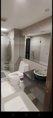 a bathroom with a toilet and a sink at Rawai The Title V 1BR in Rawai Beach
