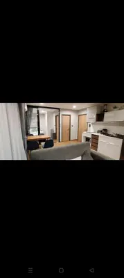 a view of a living room with a kitchen at Rawai The Title V 1BR in Rawai Beach