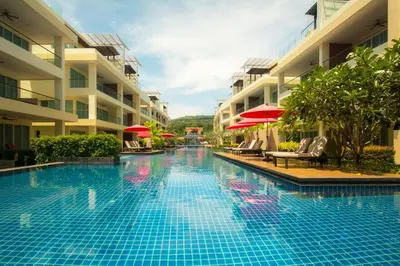 a swimming pool in the middle of a hotel at Krabi One Bedroom Seaview in Klong Muang Beach