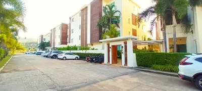 a row of cars parked in a parking lot at Krabi One Bedroom Seaview in Klong Muang Beach