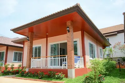 a house with an orange and white at VK House Rawai, Phuket in Rawai Beach
