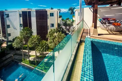 a view from the balcony of a hotel with a swimming pool at Krabi Luxury Penthouse in Klong Muang Beach